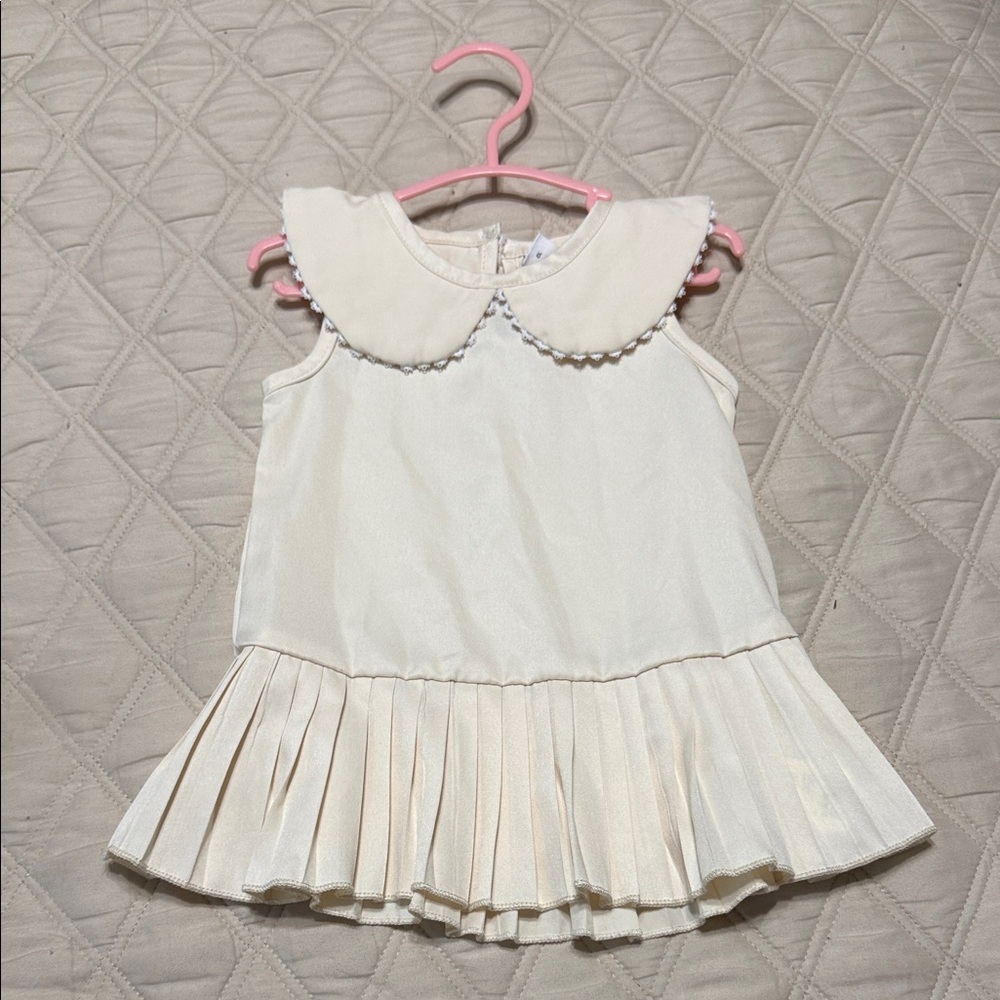 Cream Sleeveless Dress with Pleated Skirt